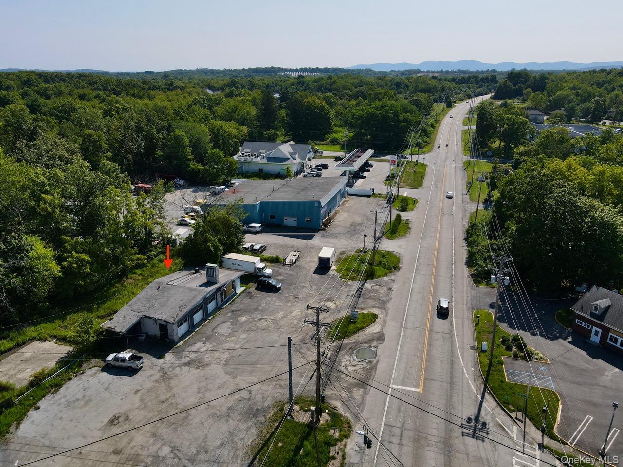 View of property location featuring a heavily wooded area
