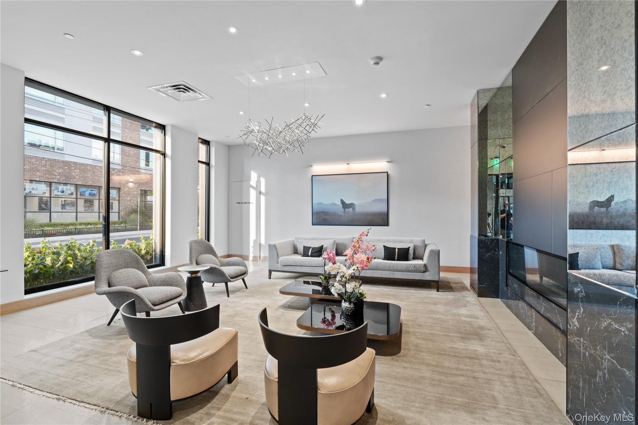 Common area with expansive windows and recessed lighting