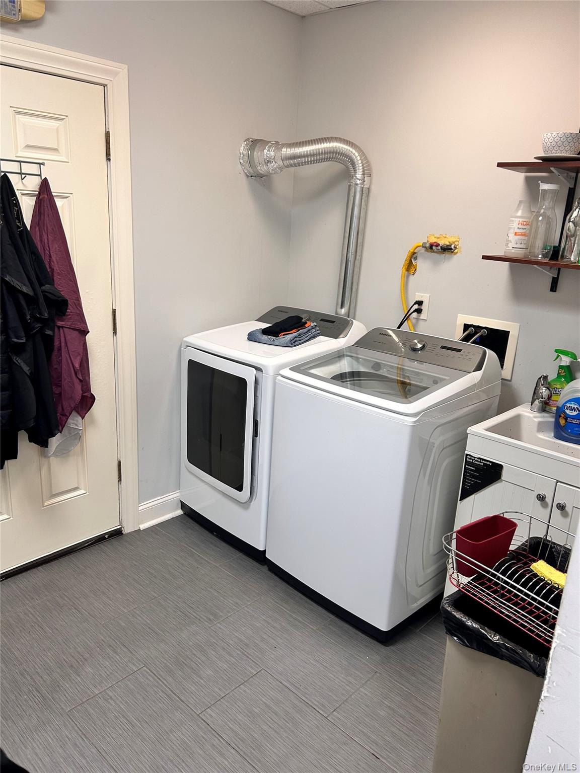 Washroom featuring washer and clothes dryer