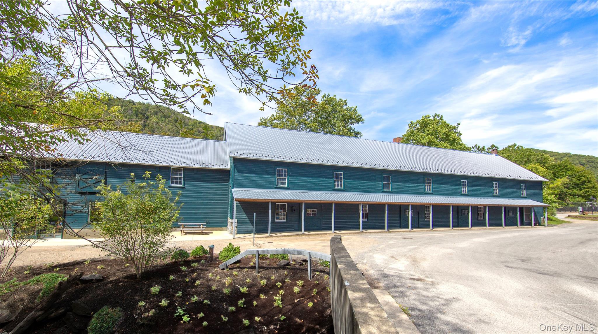 Nestled in the heart of Wassaic Hamlet on Main Street, this meticulously revitalized 1920s two-story barn, spanning 10,640 SF, stands as a testament to craftsmanship and vision.