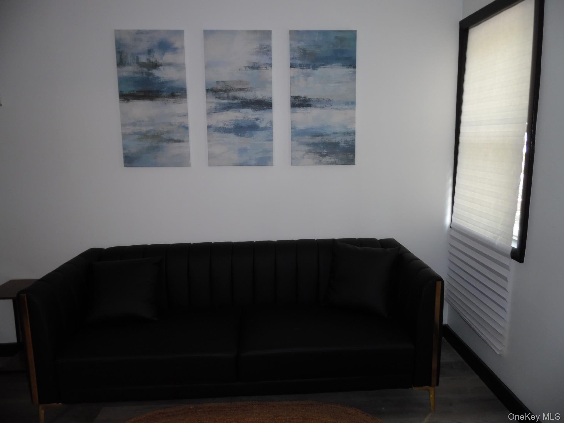 Sitting room featuring wood finished floors