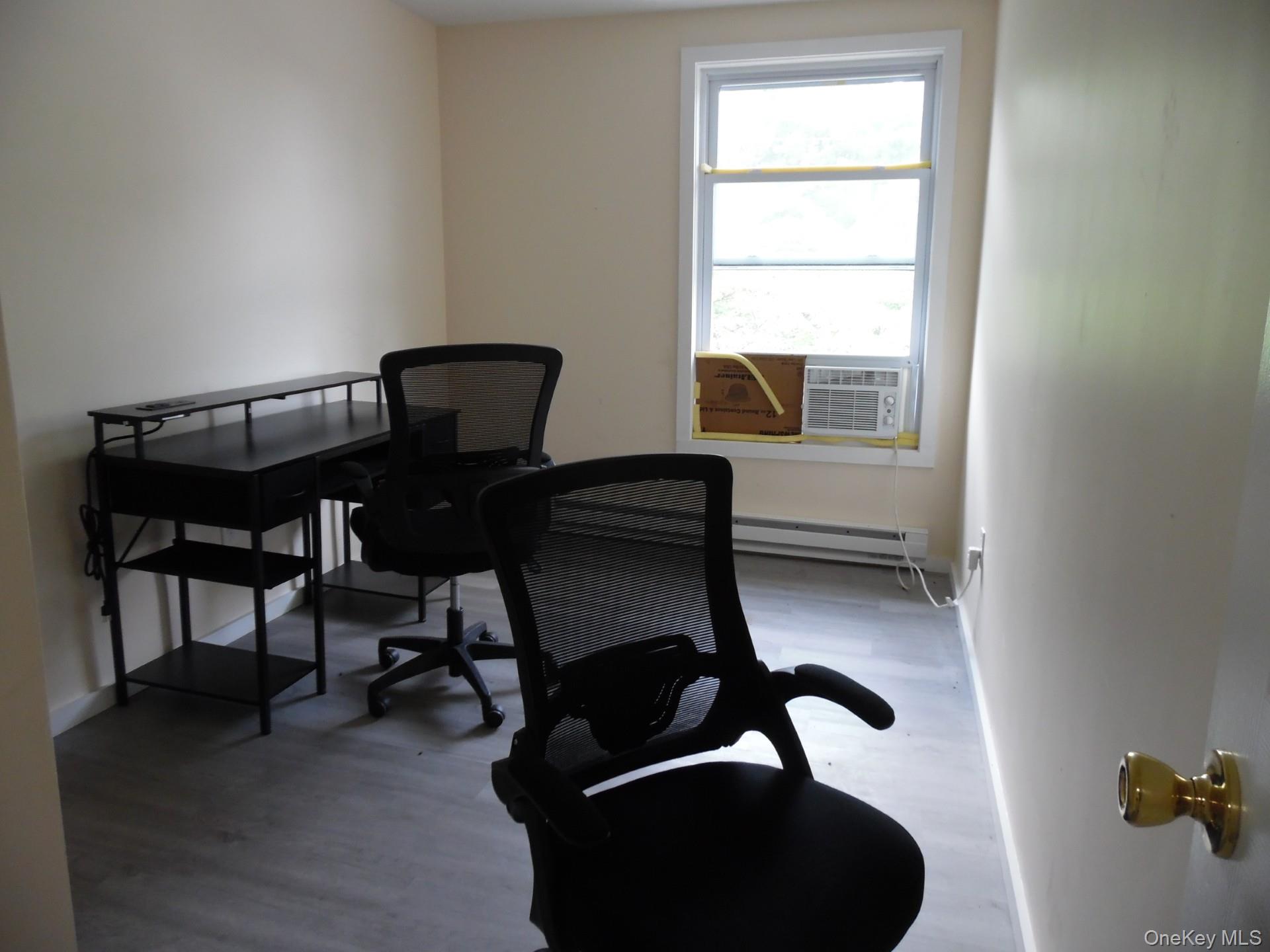 Office featuring light wood finished floors and baseboards