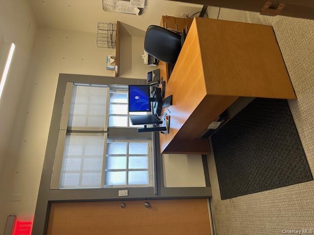 Office space with plenty of natural light, rear entrance.