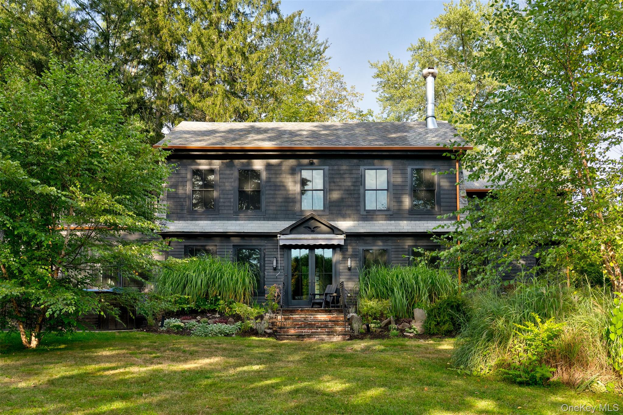 View of front of property with a front yard