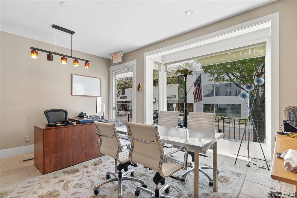 Office area featuring baseboards