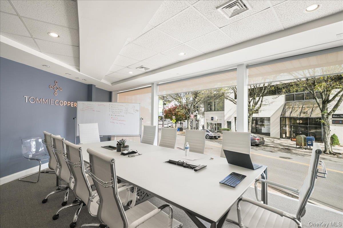 Office space featuring a paneled ceiling, recessed lighting, and carpet