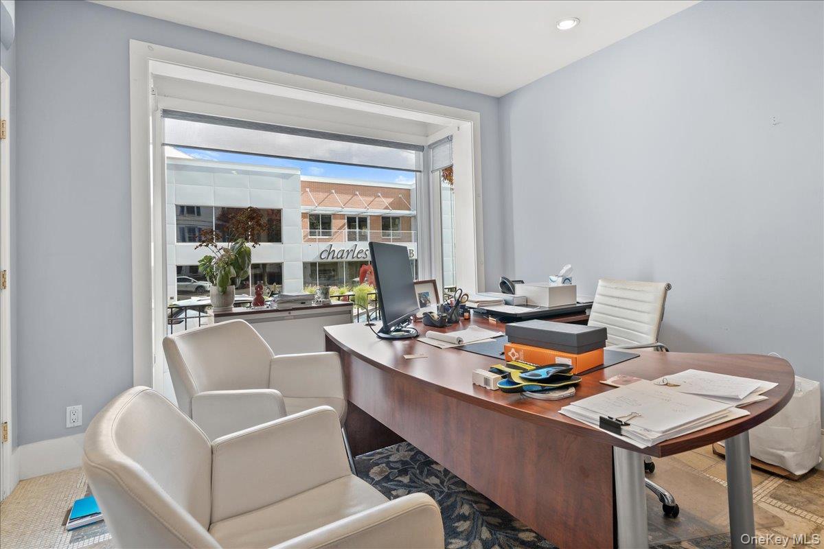Home office featuring recessed lighting