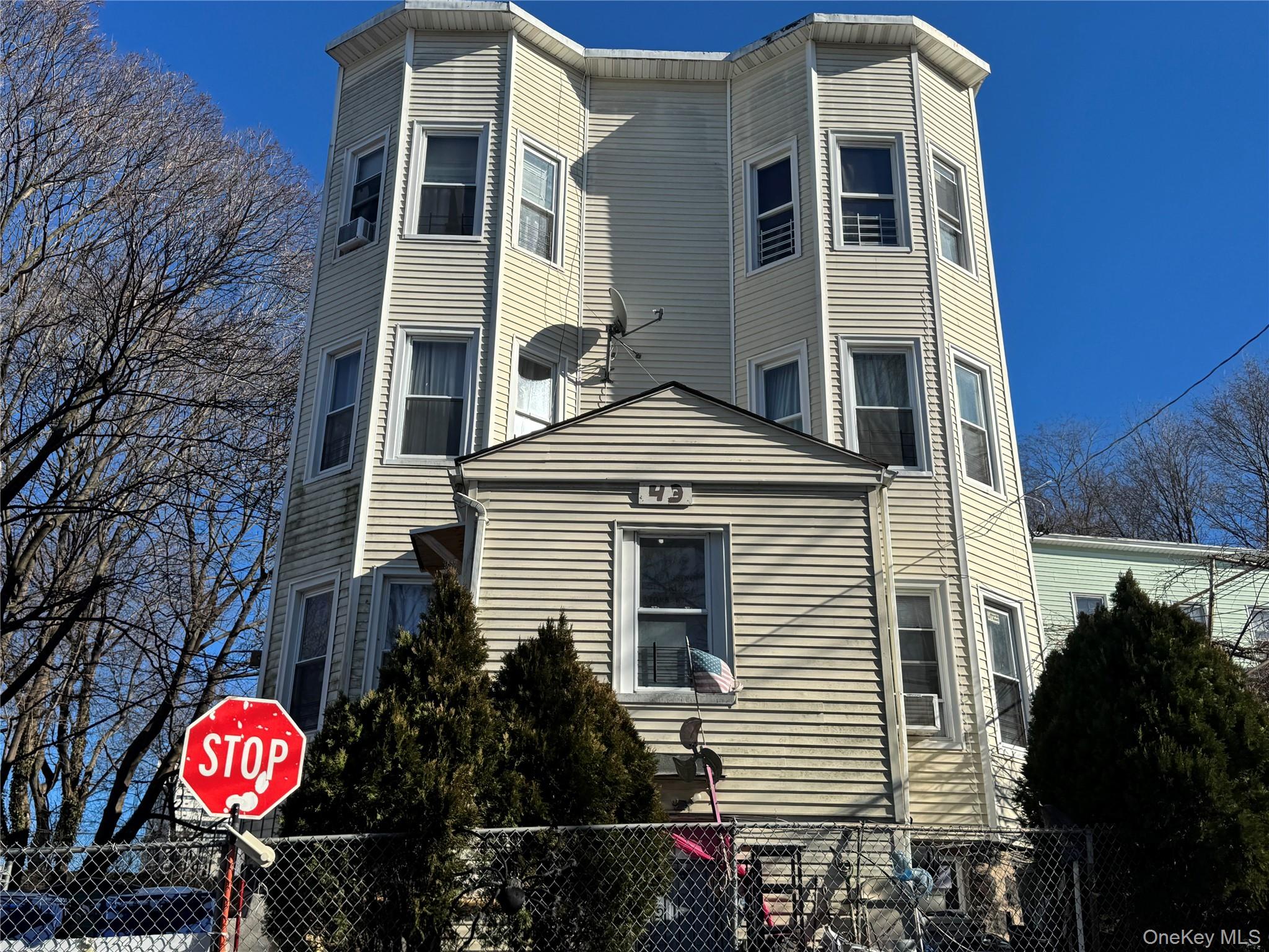 View of side of property with a fenced front yard