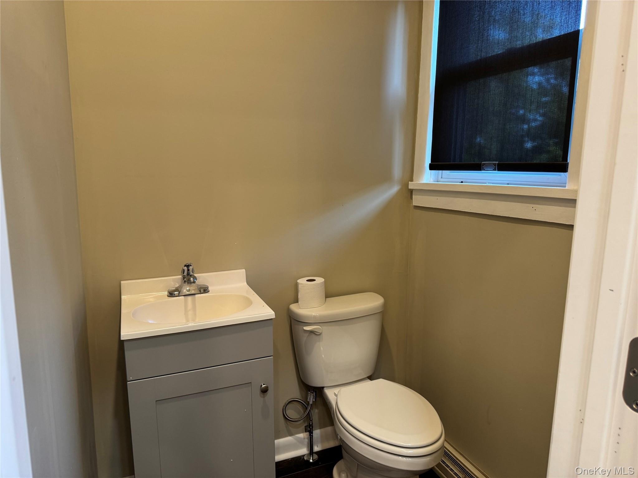 Half Bathroom with a vanity