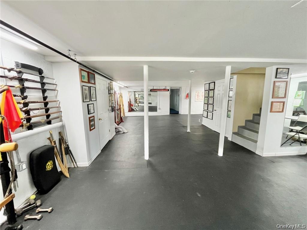 Garage featuring baseboards