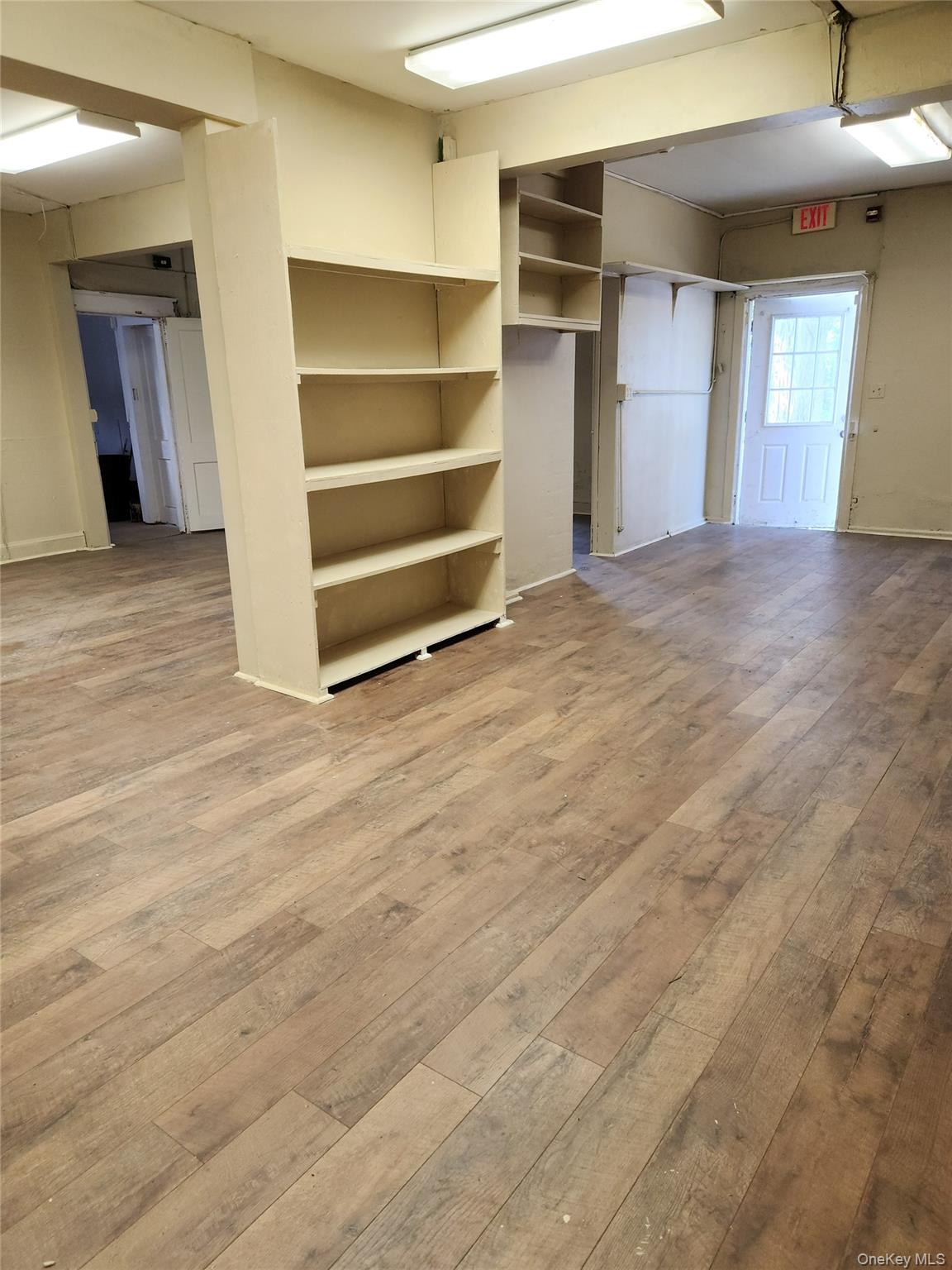 Unfurnished room featuring light wood-style floors and baseboards