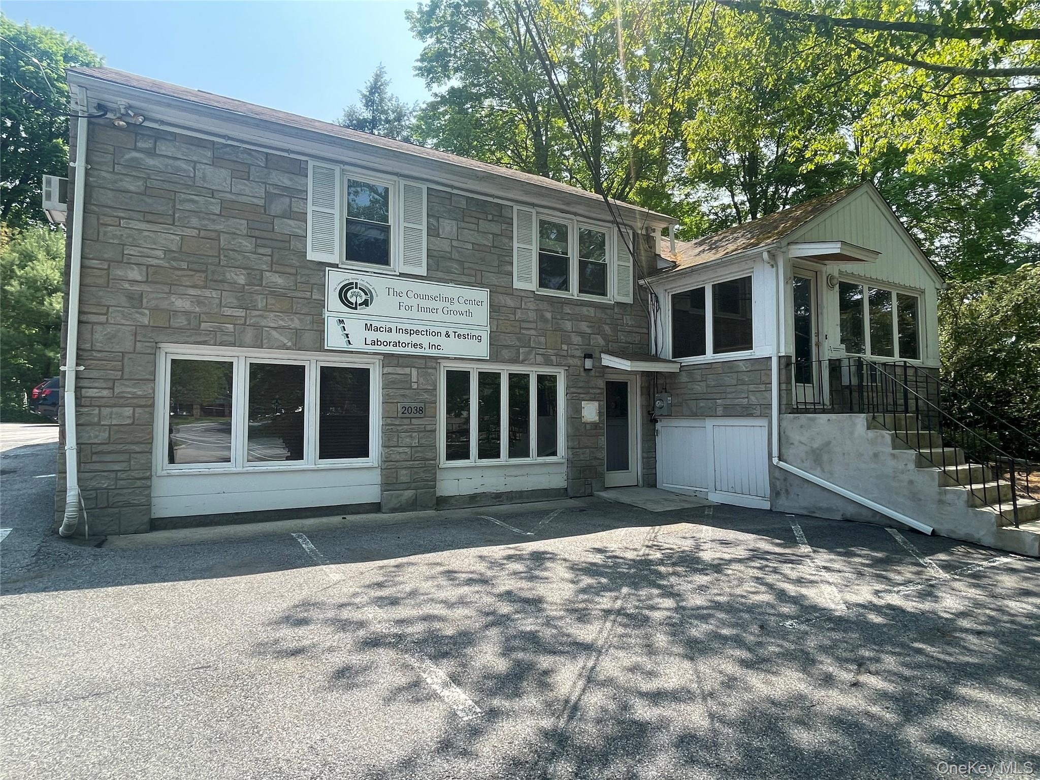 View of front of home featuring stone siding