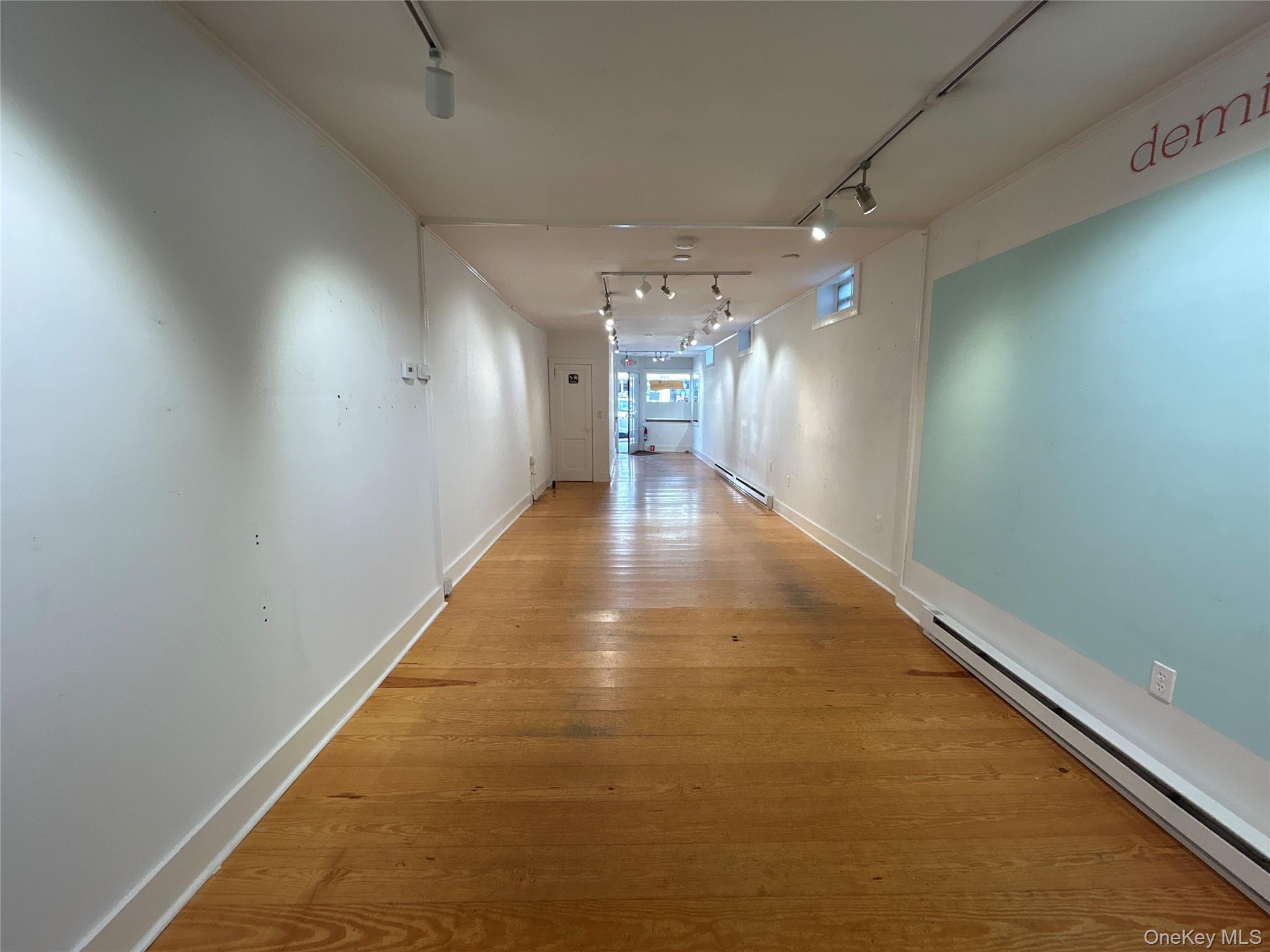 View from back to front with wood floors