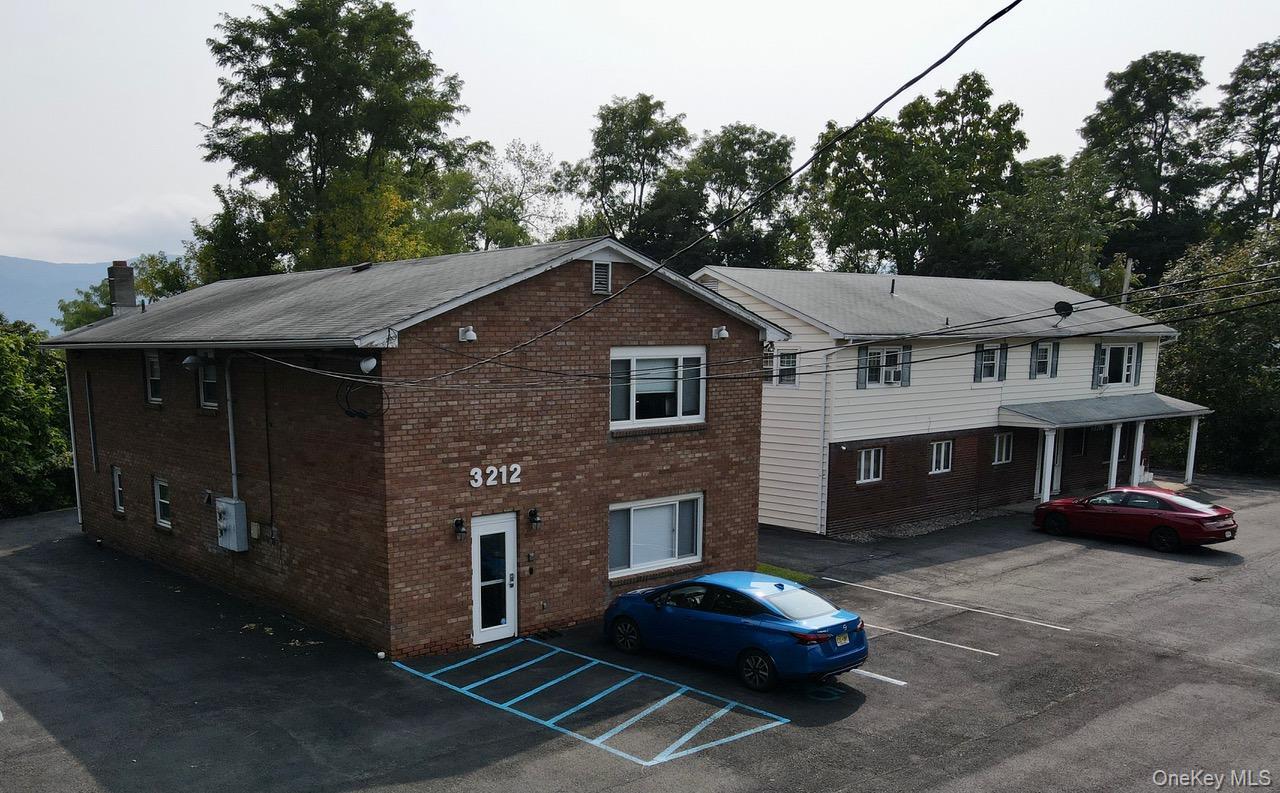 View of property with front entrance.
