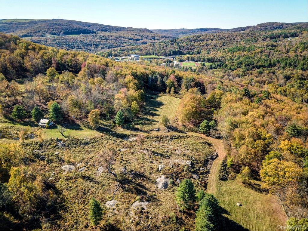 Aerial view of property and beautiful approach