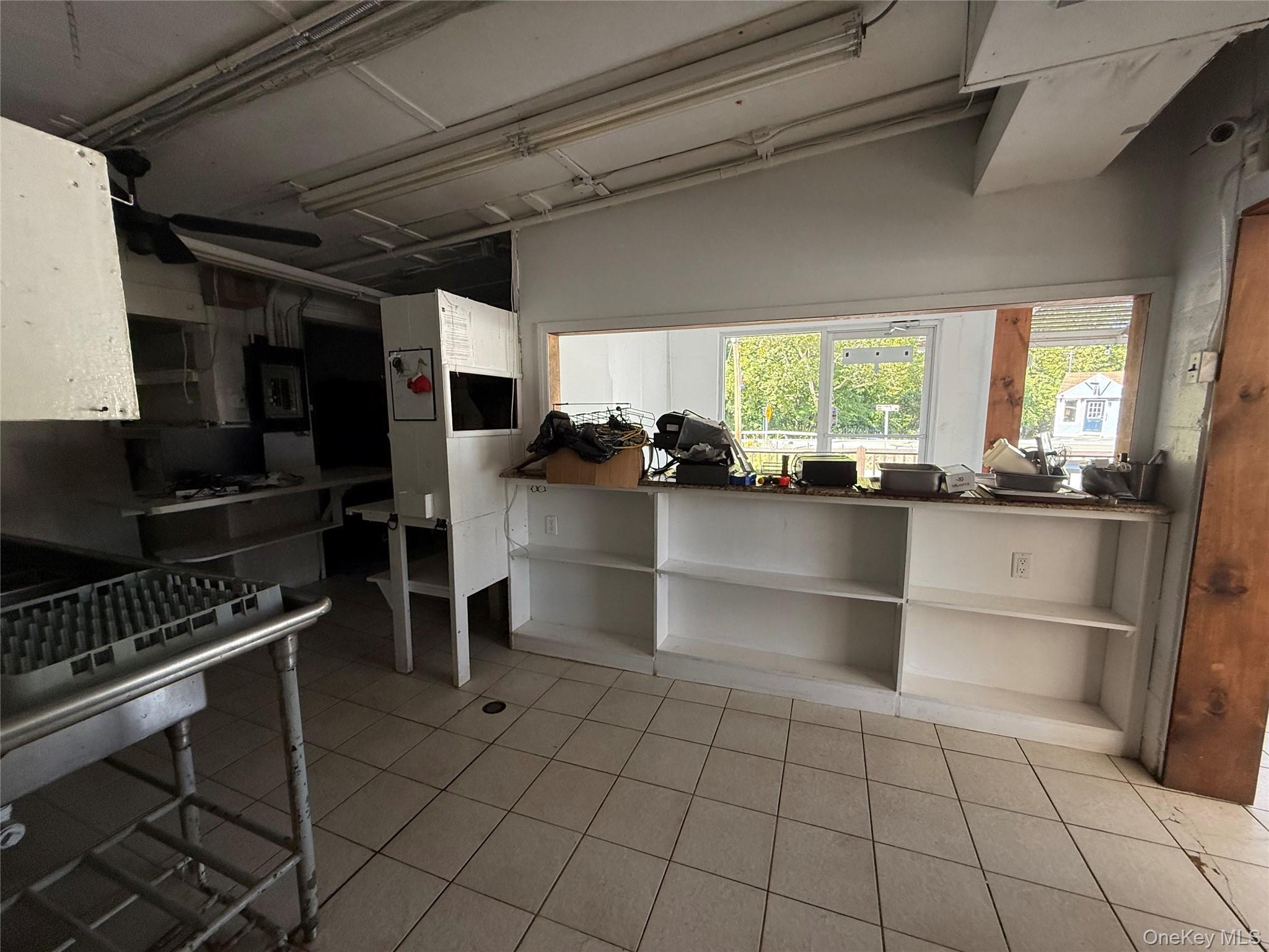 Kitchen with light tile patterned floors