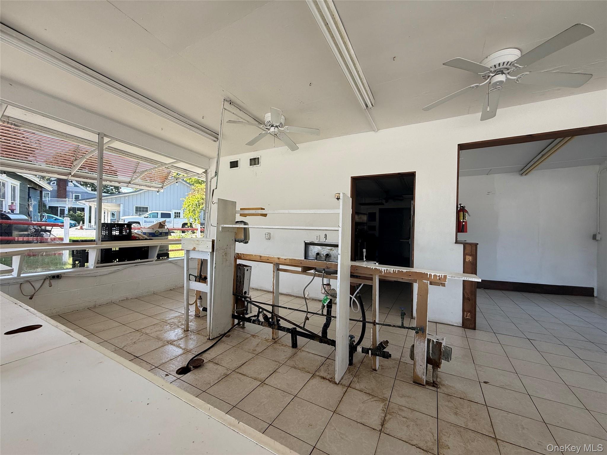 View of patio featuring a ceiling fan