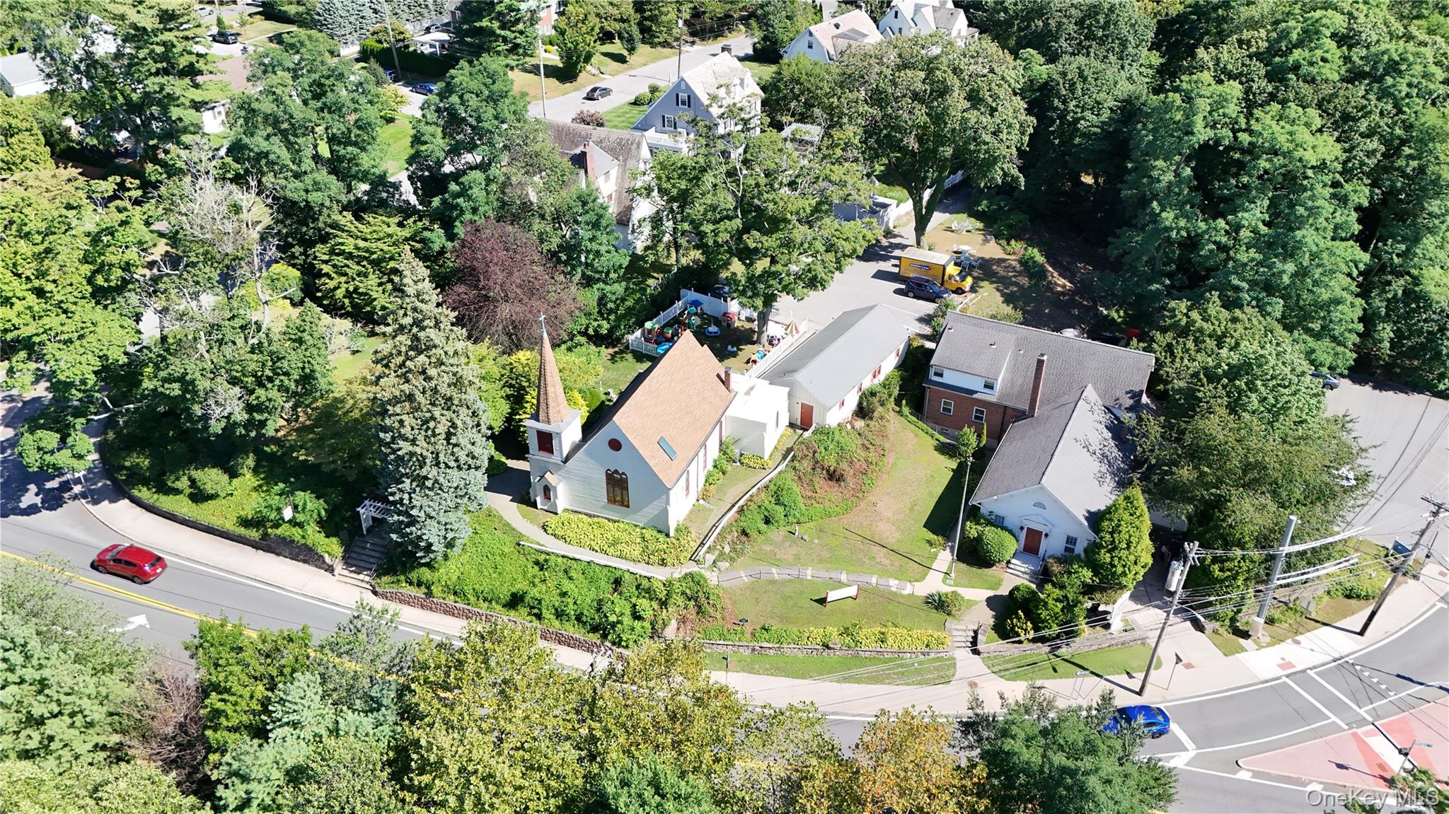 Aerial view of residential area with a tree filled landscape