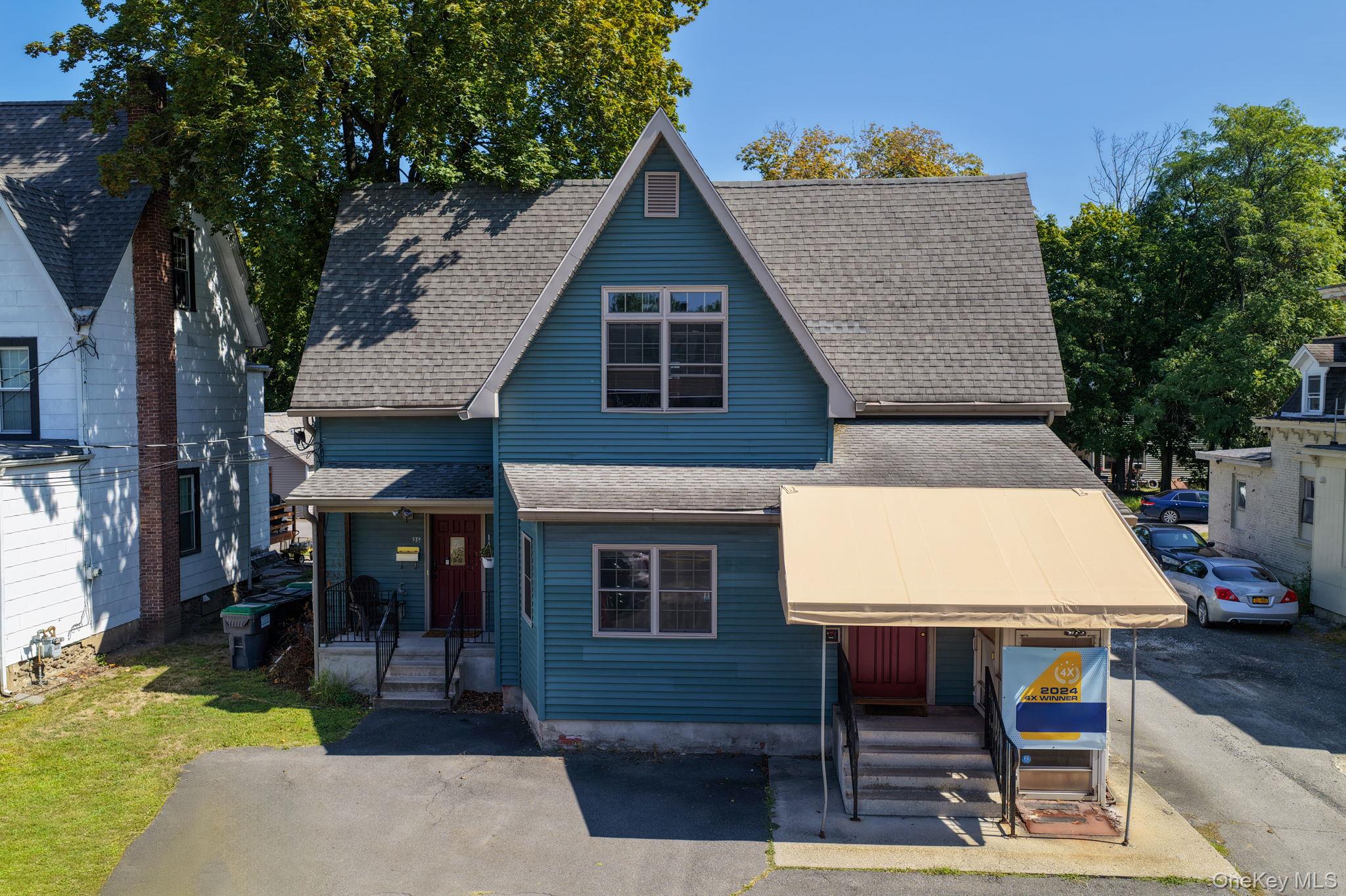 View of front facade with a shingled roof