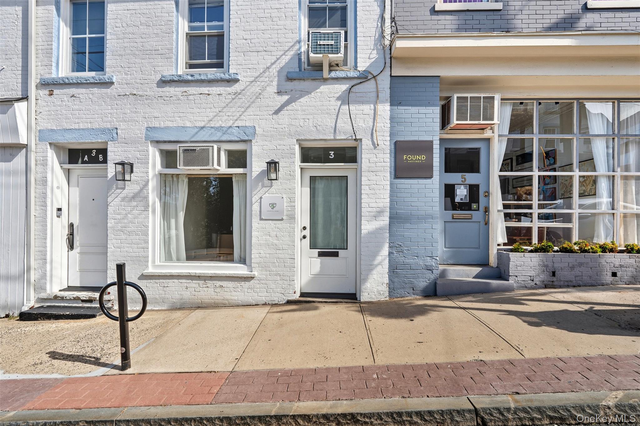 Property entrance with brick siding