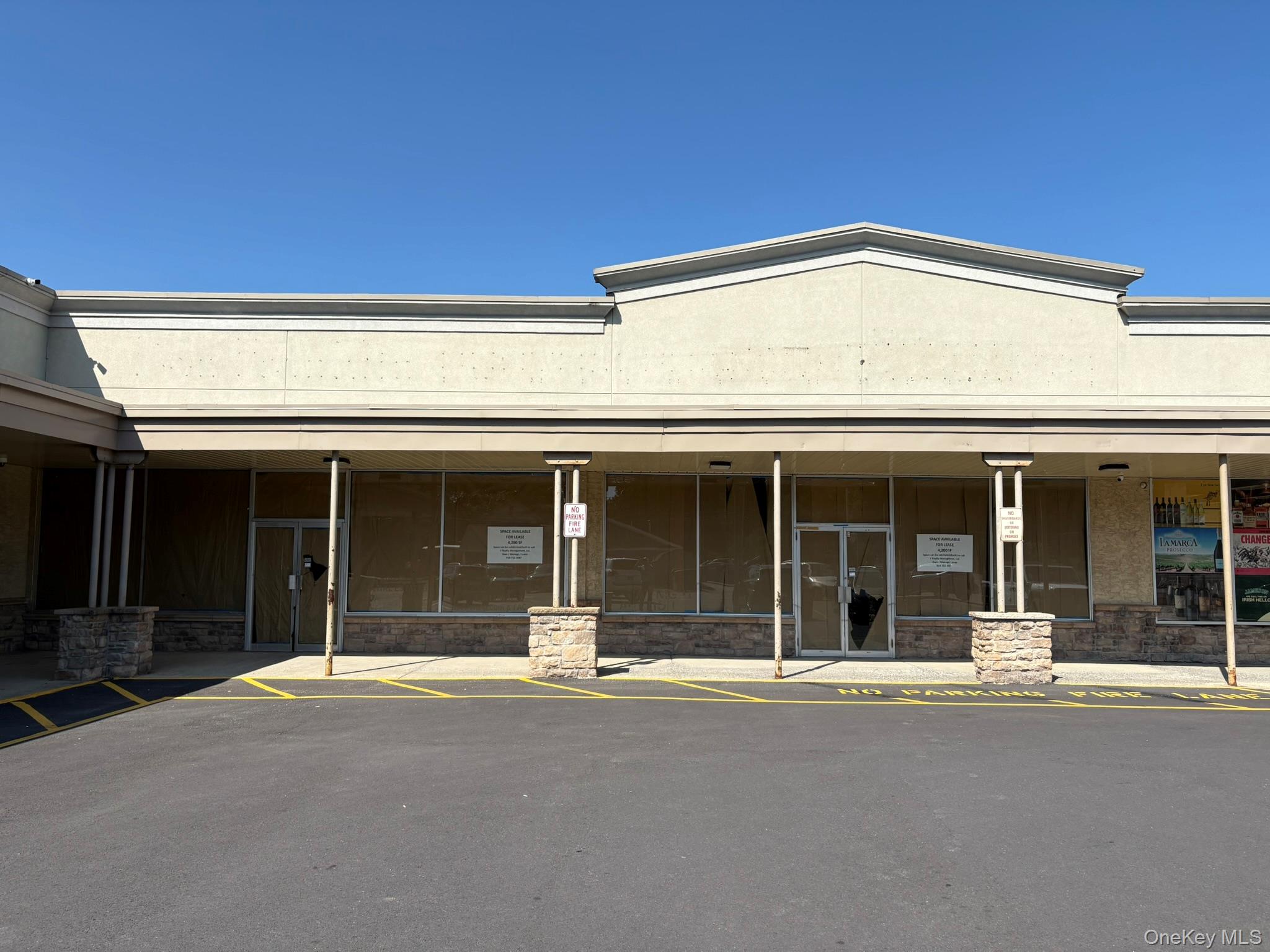 View of exterior entry with uncovered parking