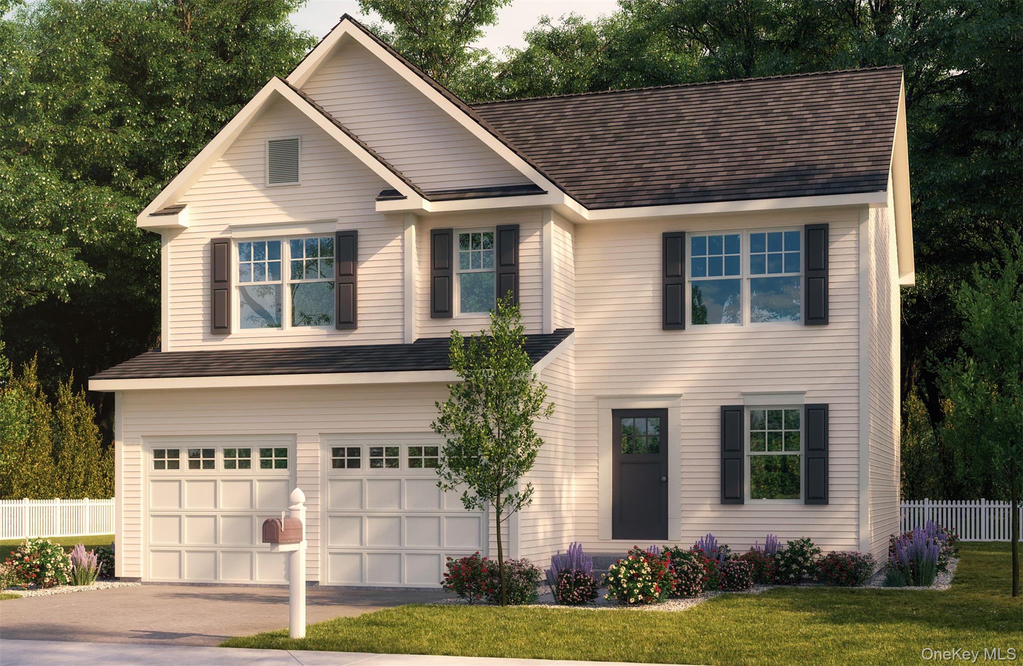 Traditional-style house with an attached garage and driveway