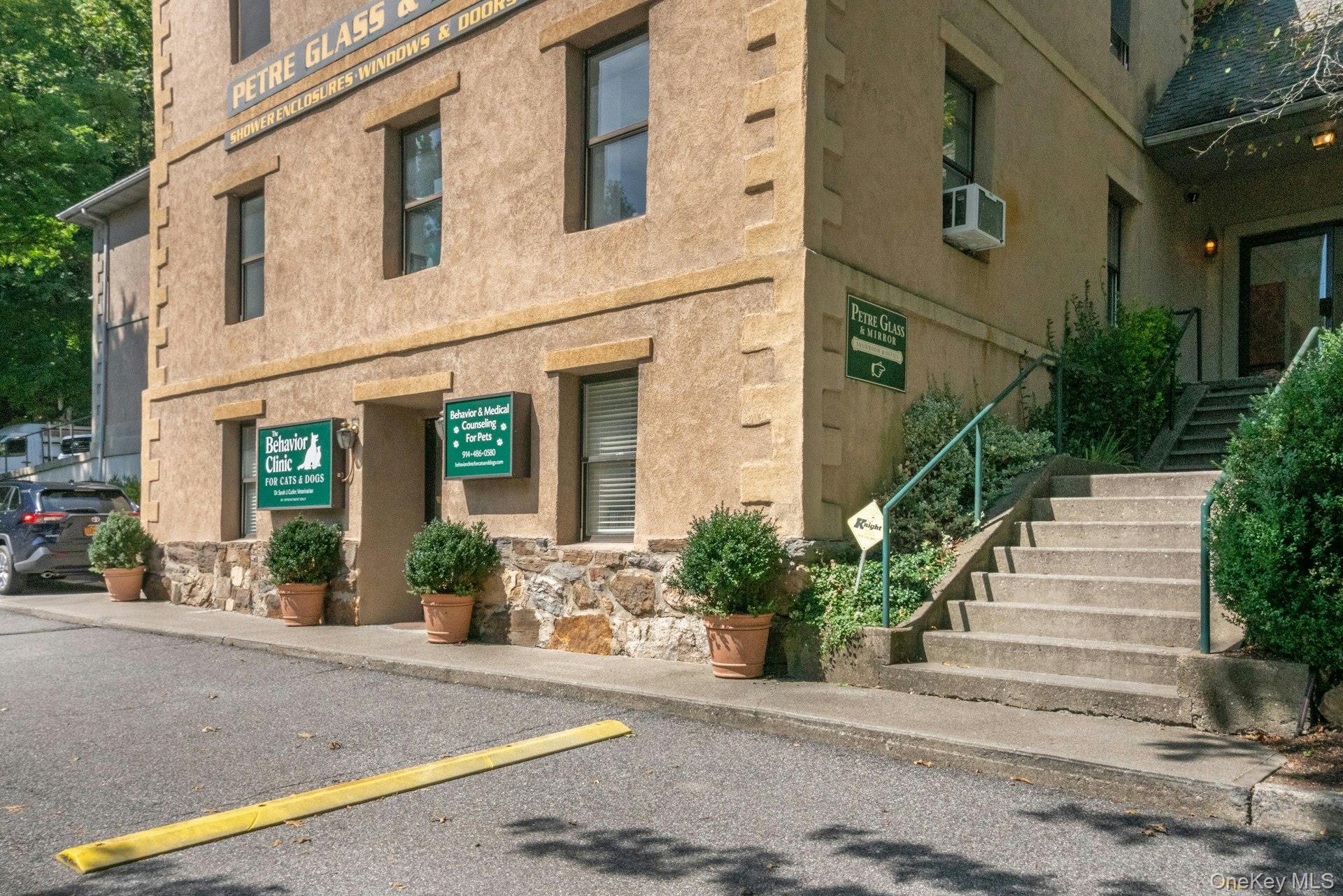 View of property featuring stairway