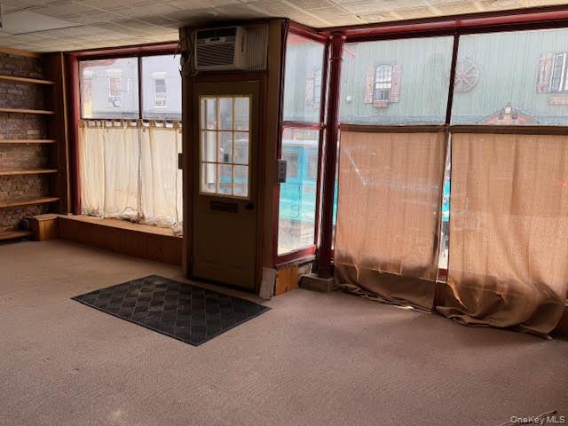 Interior of the subject space. View of the large windows from inside of the space...