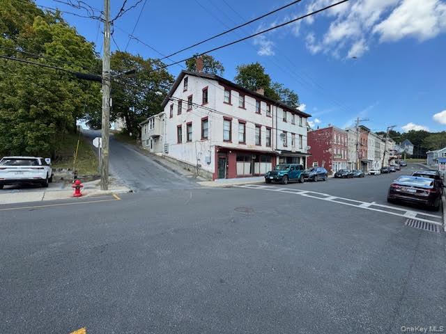 View of the entire corner where the subject building is located.