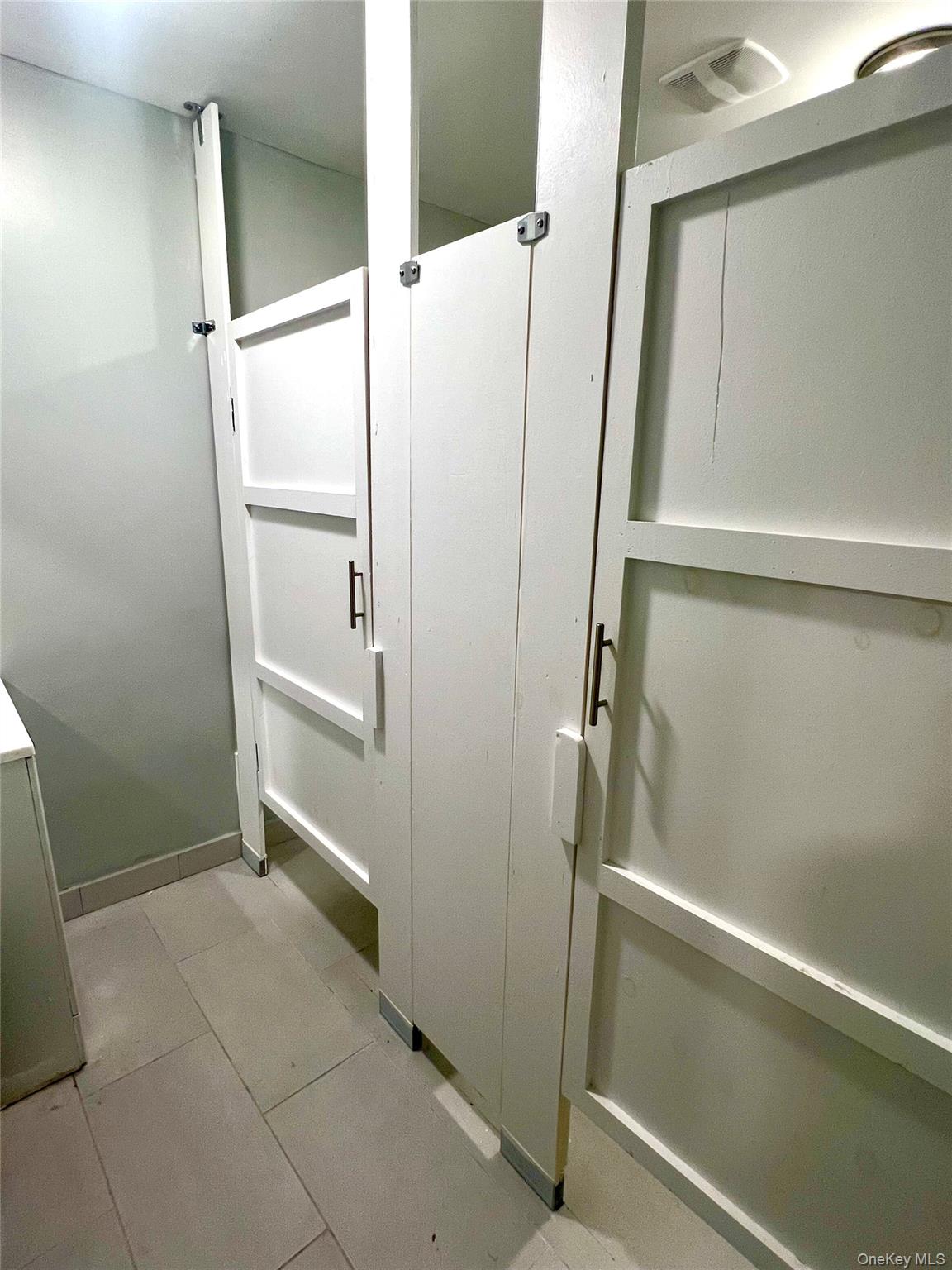 Bathroom featuring light tile patterned flooring
