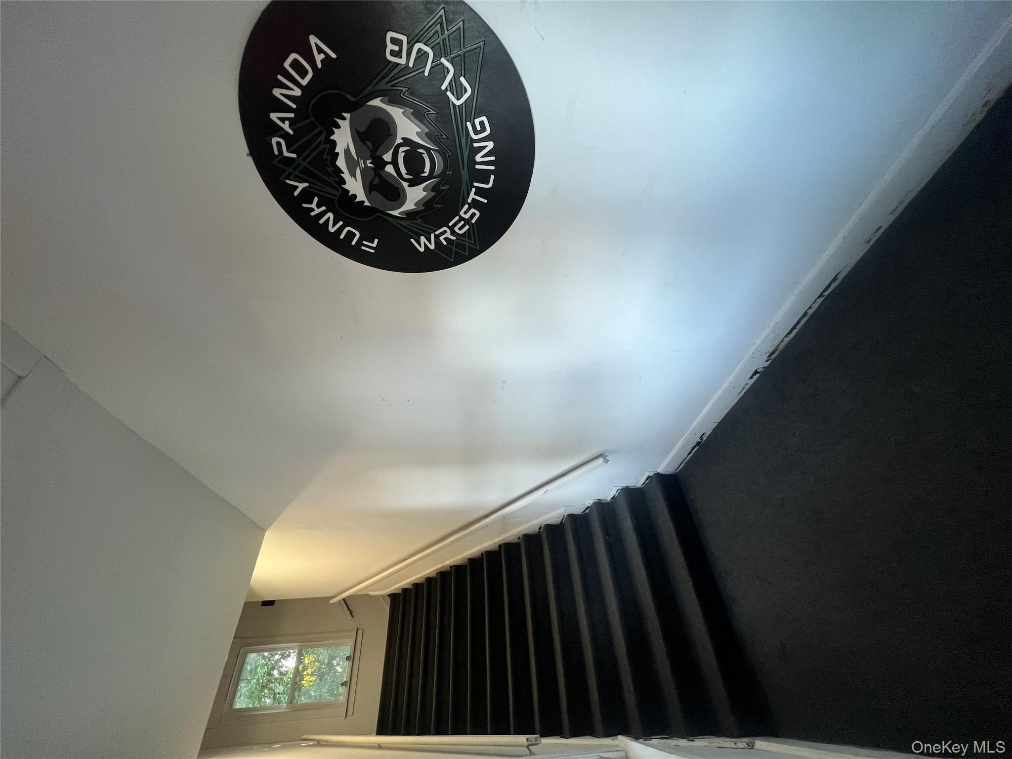 Stairway featuring baseboards