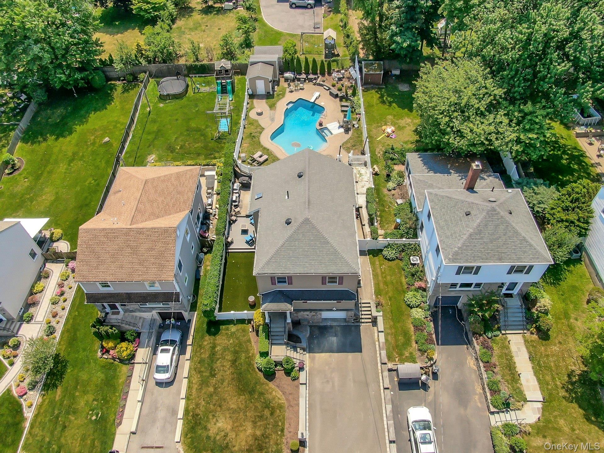 Welcome to 78 Tuckahoe Avenue as we view the home from above highlighting the in-ground pool