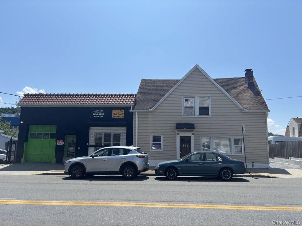 View of front of house featuring a chimney