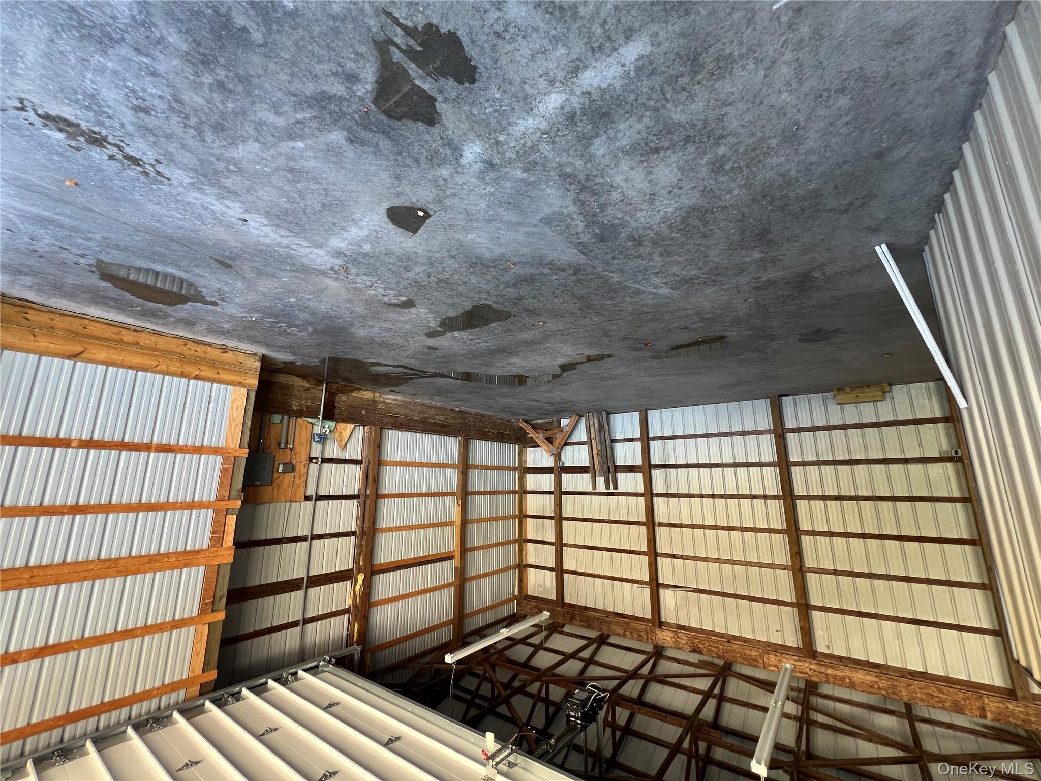 Garage with metal wall and a garage door opener