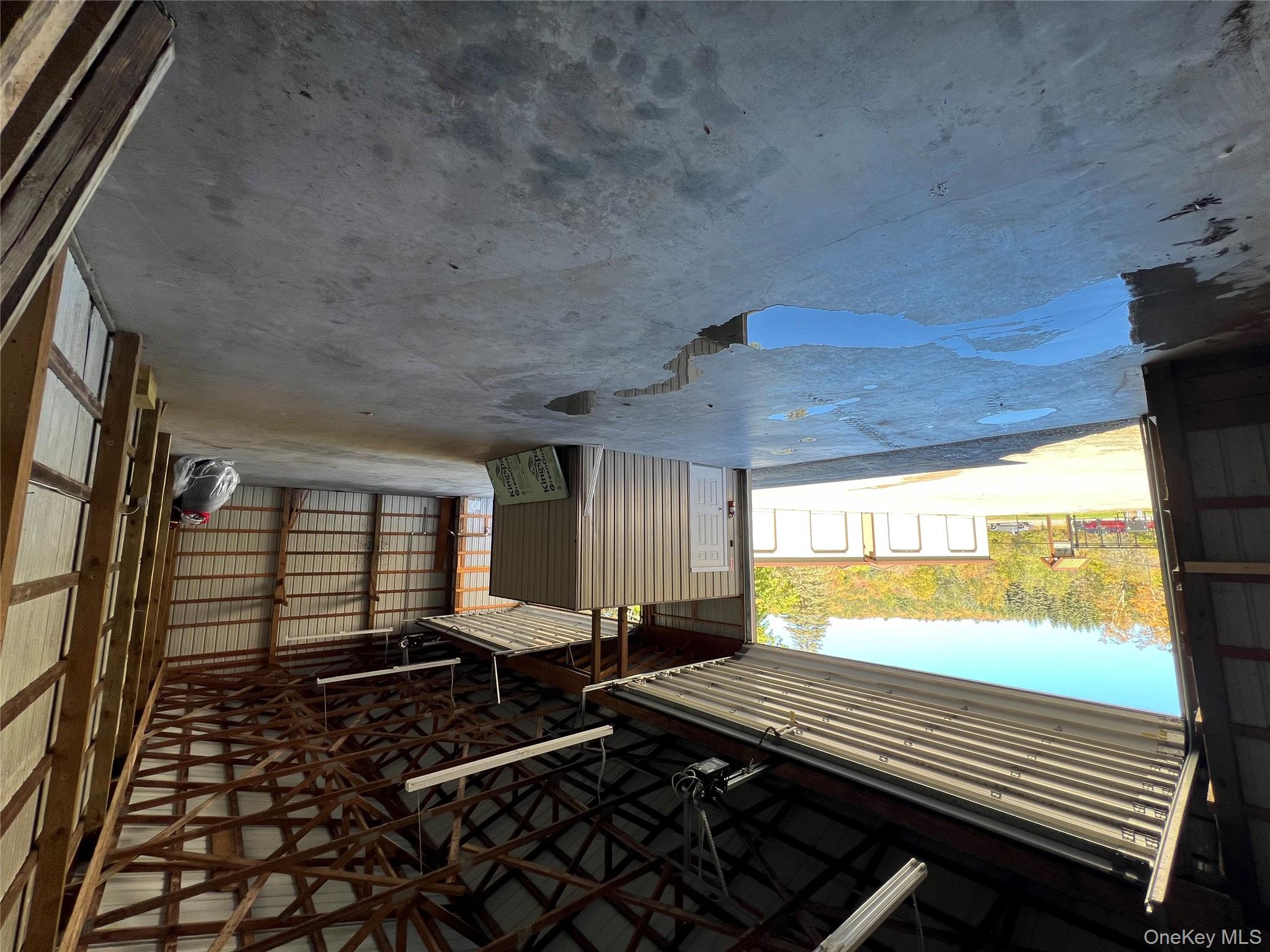 Garage with metal wall and a garage door opener