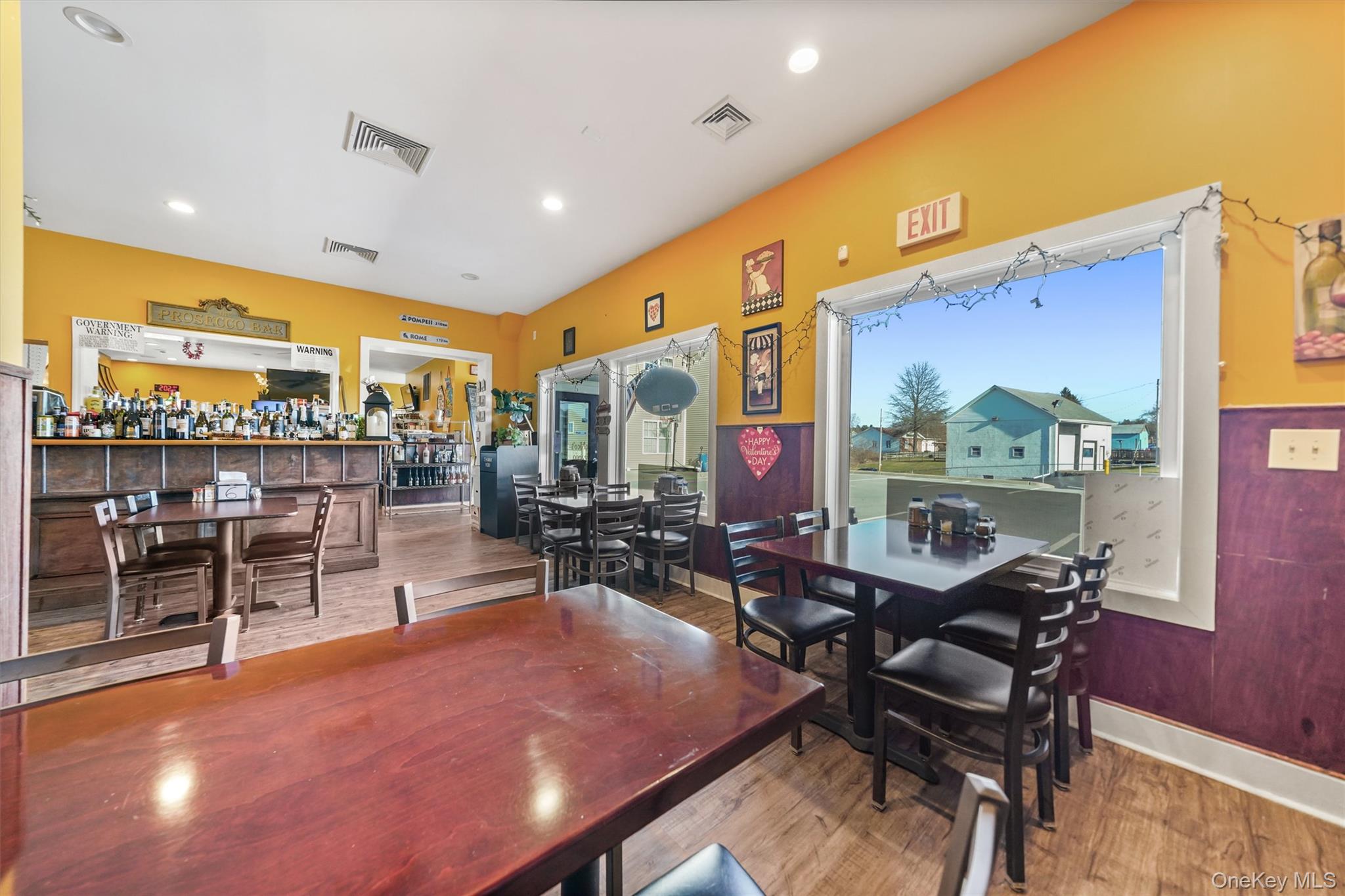 Dining area featuring wood finished floors and recessed lighting