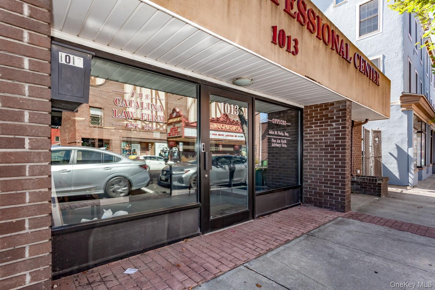 Doorway to property with brick siding