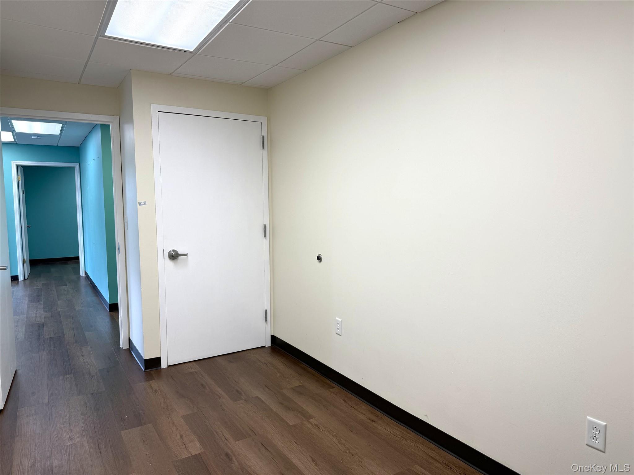 Wide hallway would be a perfect spot for an office kitchenette! Coffee station, water cooler, fridge, microwave, snacks...