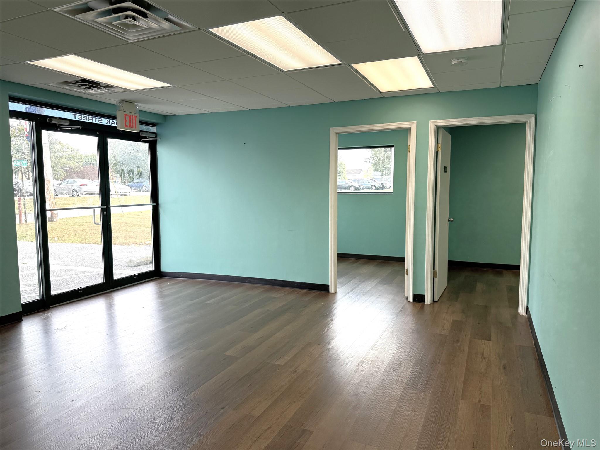 Reception room. Luxury Vinyl Plank flooring runs throughout the unit!