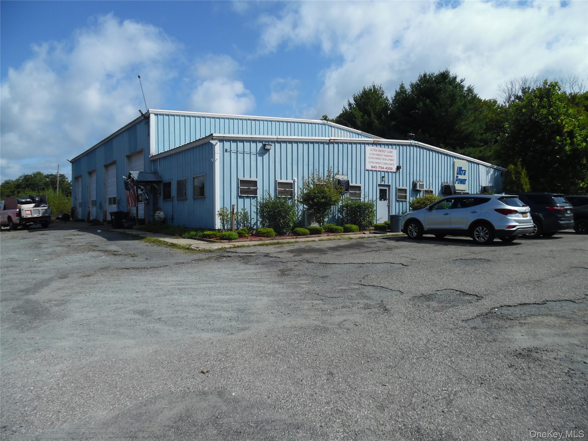 View of property with uncovered parking