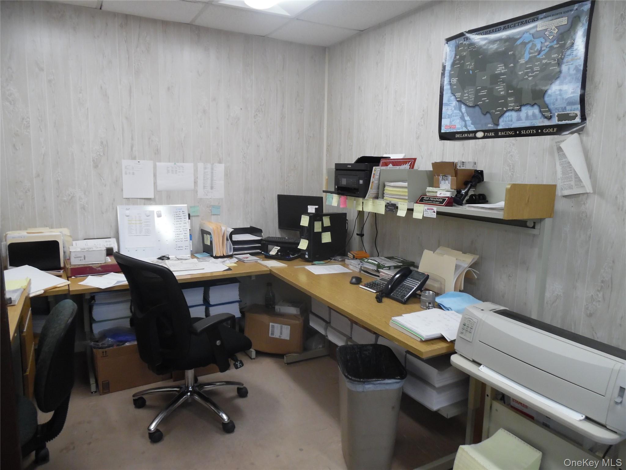 Office area featuring a drop ceiling