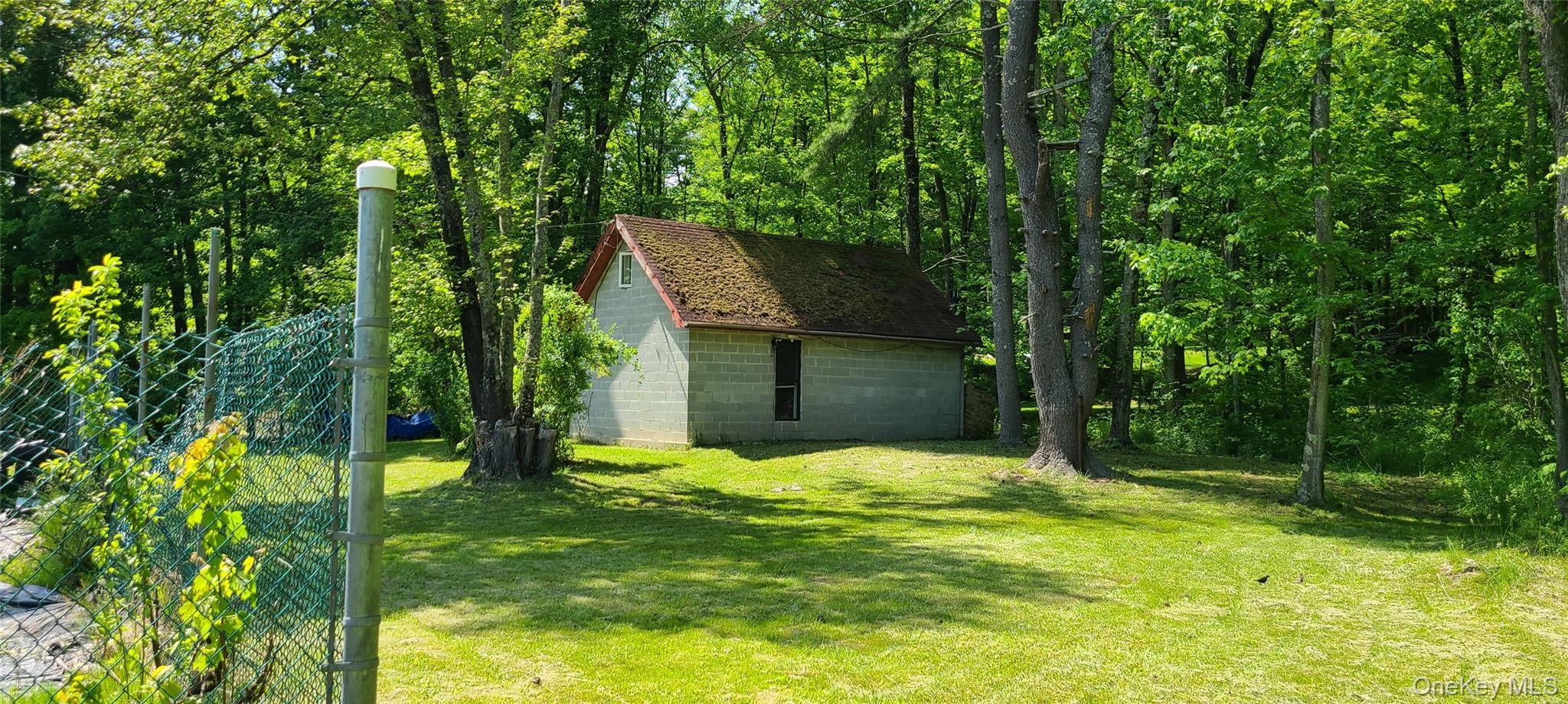 View of green lawn with an outdoor structure