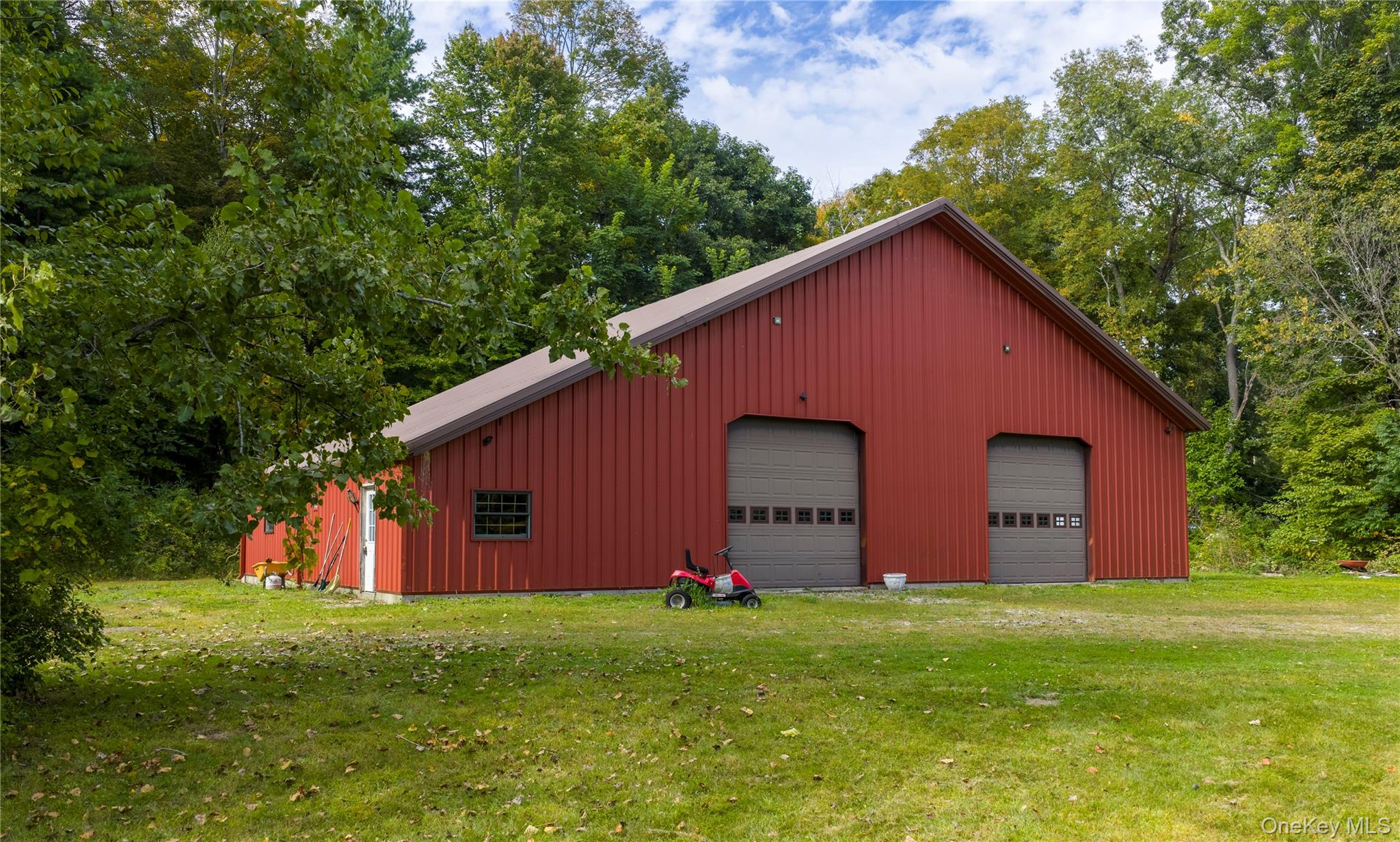 3,500 SF steel barn with a 3 story contemporary home and inground pool with OC zoning in Amenia.