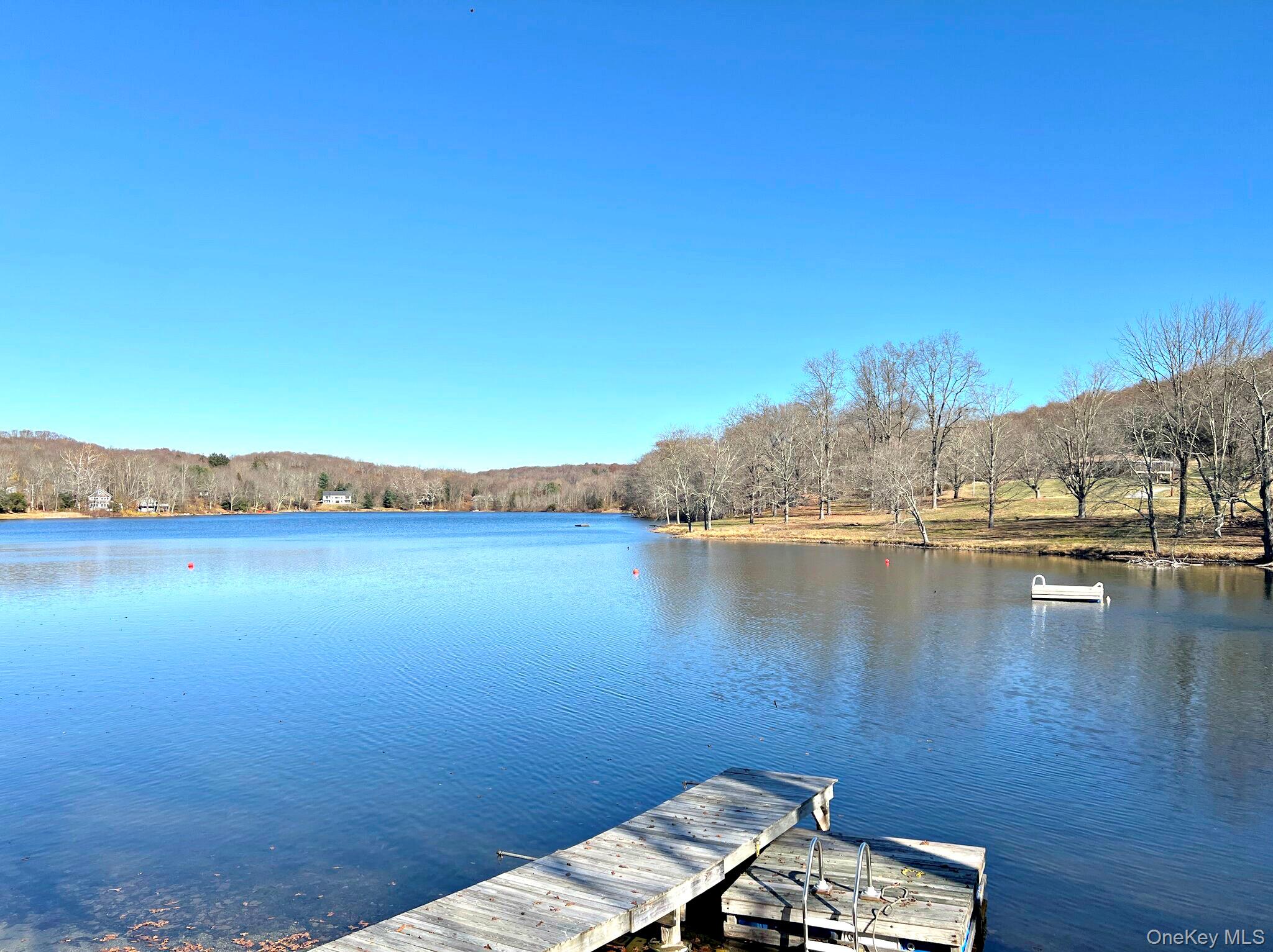 Dock area featuring a water view