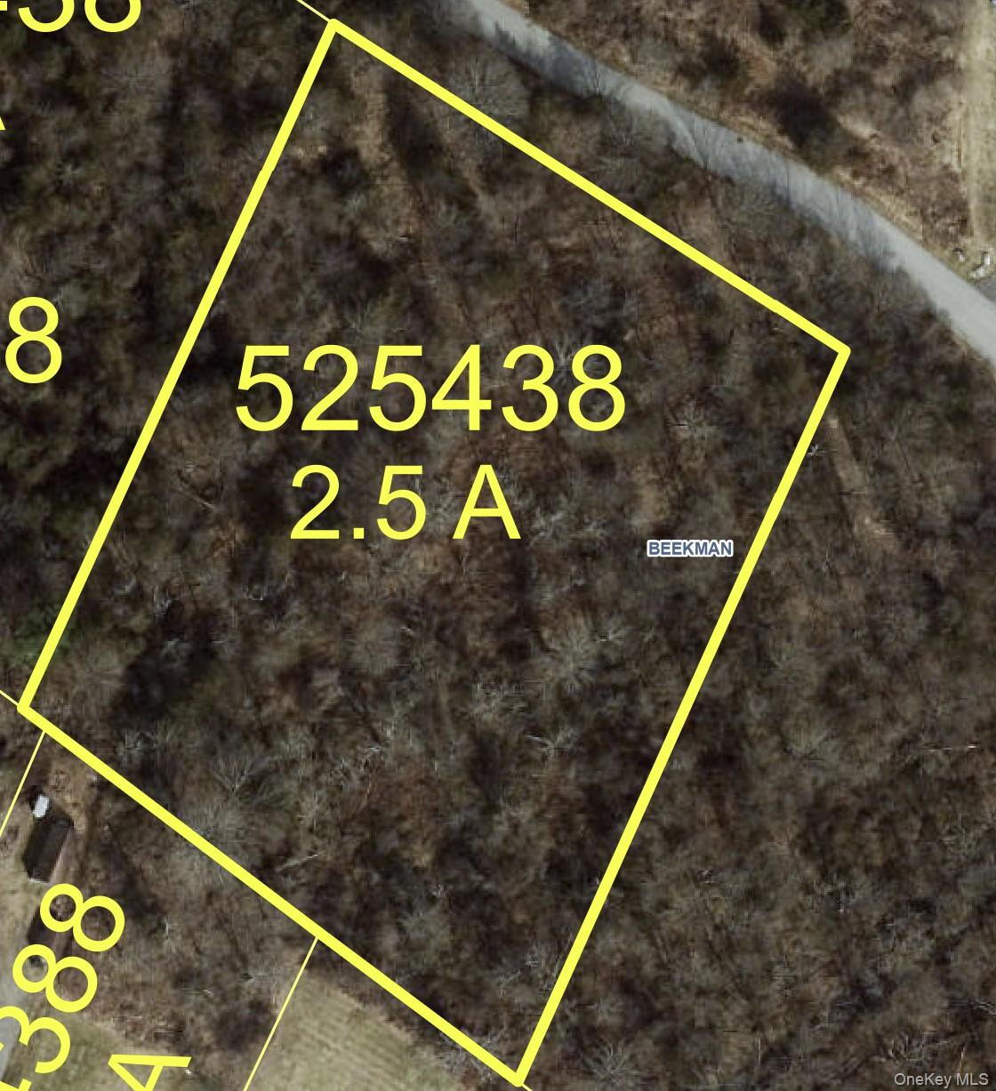 Aerial map of property and surrounding area featuring property parcel outlined