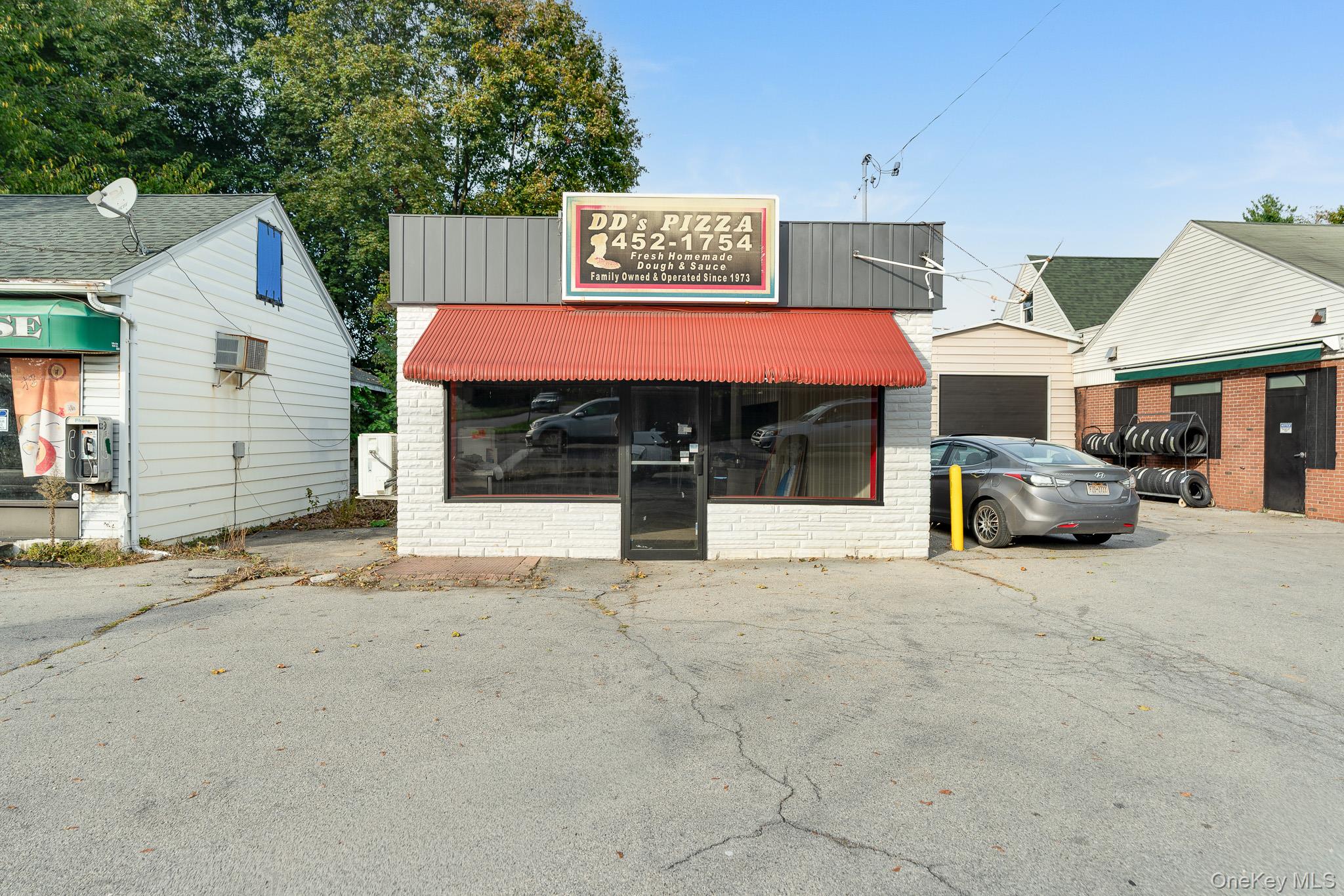 View of commercial property featuring a garage