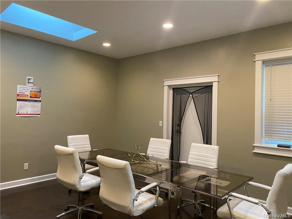 Dining area featuring recessed lighting and a skylight