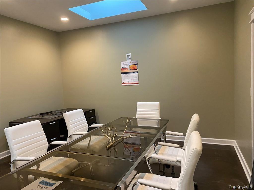 Office area featuring recessed lighting and a skylight