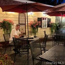 View of patio with outdoor dining area