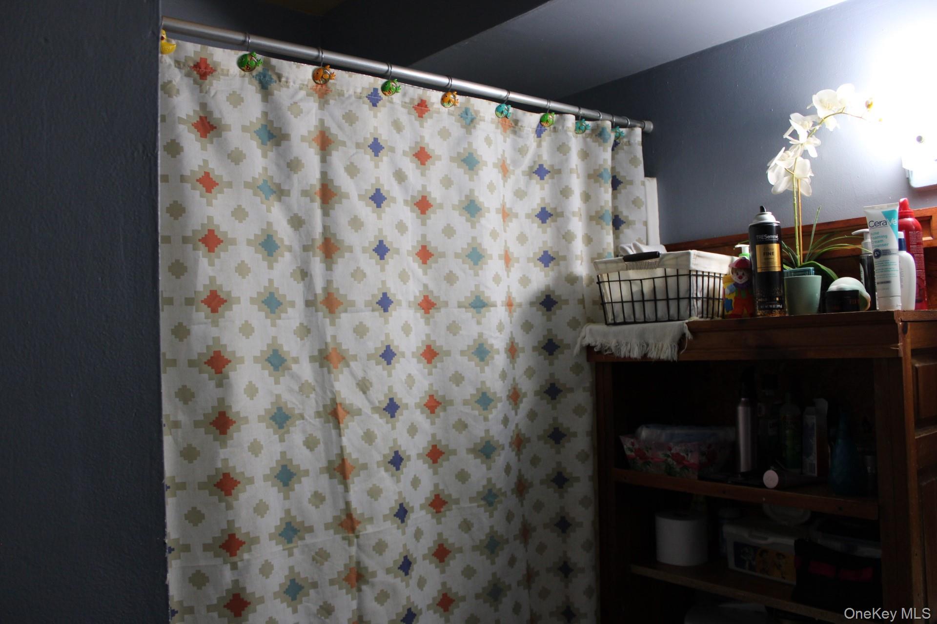 Bathroom featuring a shower with tub